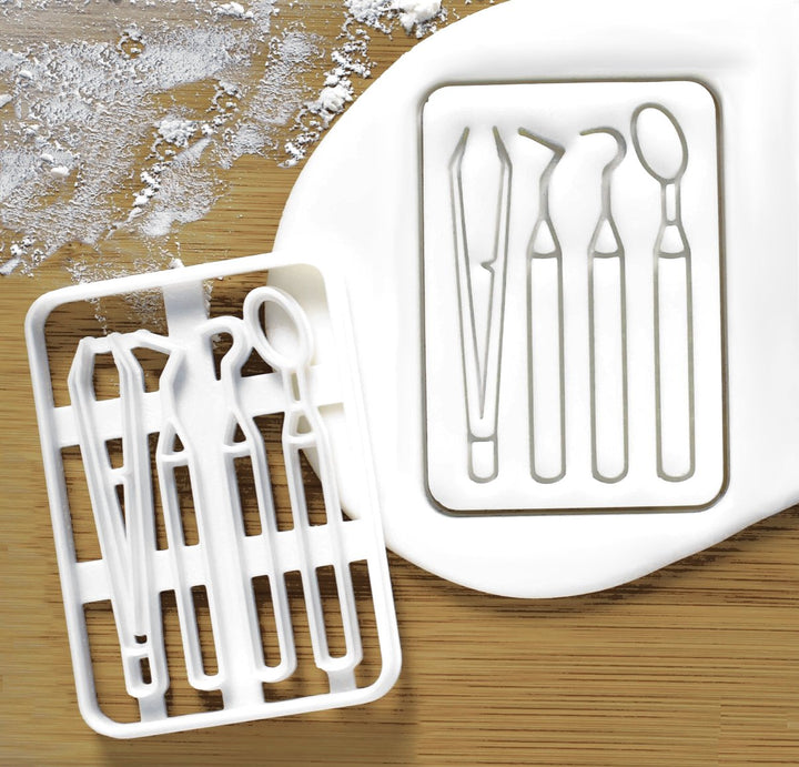 Dentist Dental Tools Cookie Cutter, shaped like essential dental instruments. Ideal for baking fun and themed cookies for dental professionals, parties, or celebrations, this cutter brings a creative touch to your baking and is perfect for dental-themed events.