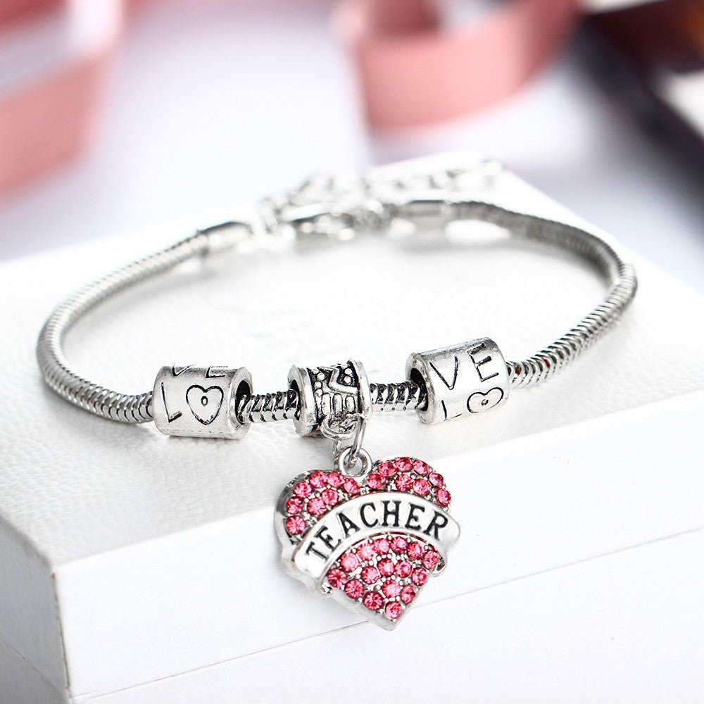 Teacher Pink Diamante Heart Bracelet - A stylish and elegant bracelet adorned with pink diamantes in a heart design, perfect for educators looking to add a touch of sparkle to their accessories.