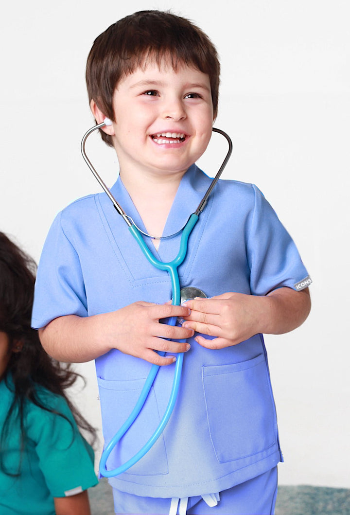 Children's Dress Up Scrubs designed for imaginative play in education, health, and social care professions, featuring colorful patterns and a comfortable fit.