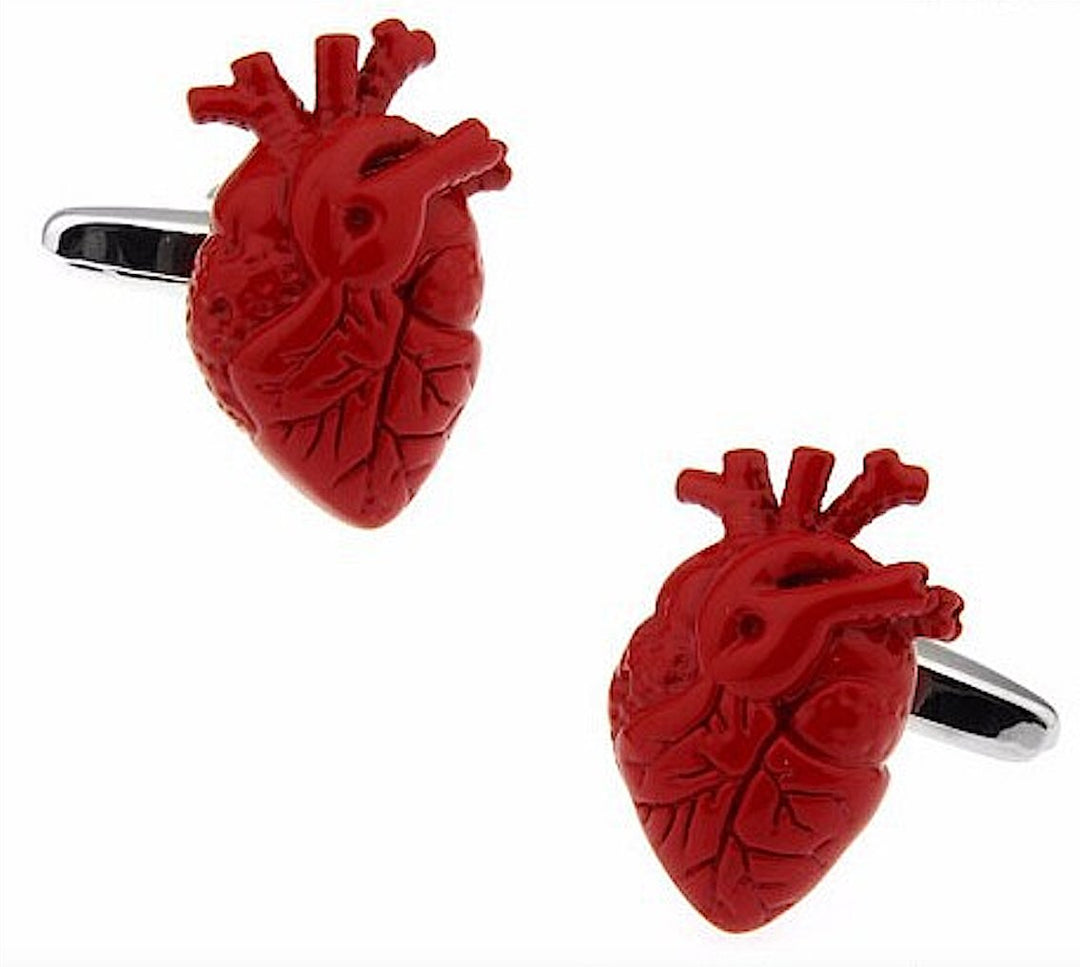 A pair of anatomically designed cufflinks shaped like human hearts, featuring intricate details and a vibrant red finish, perfect for health professionals who want to add a creative and meaningful accessory to their formal wear.