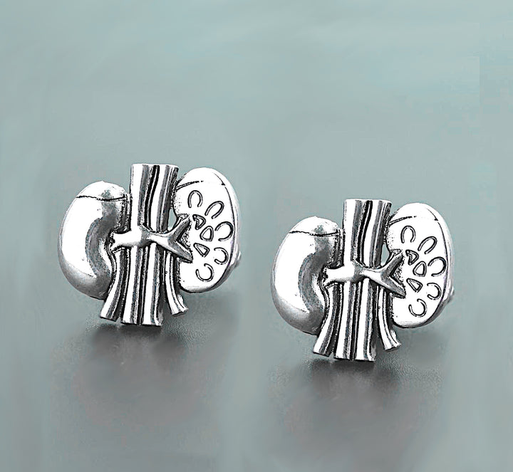 A pair of anatomically designed cufflinks shaped like human kidneys, showcasing intricate details and realistic features, presented against a neutral background. Perfect for professionals in the health field who appreciate a unique accessory that reflects their medical expertise.