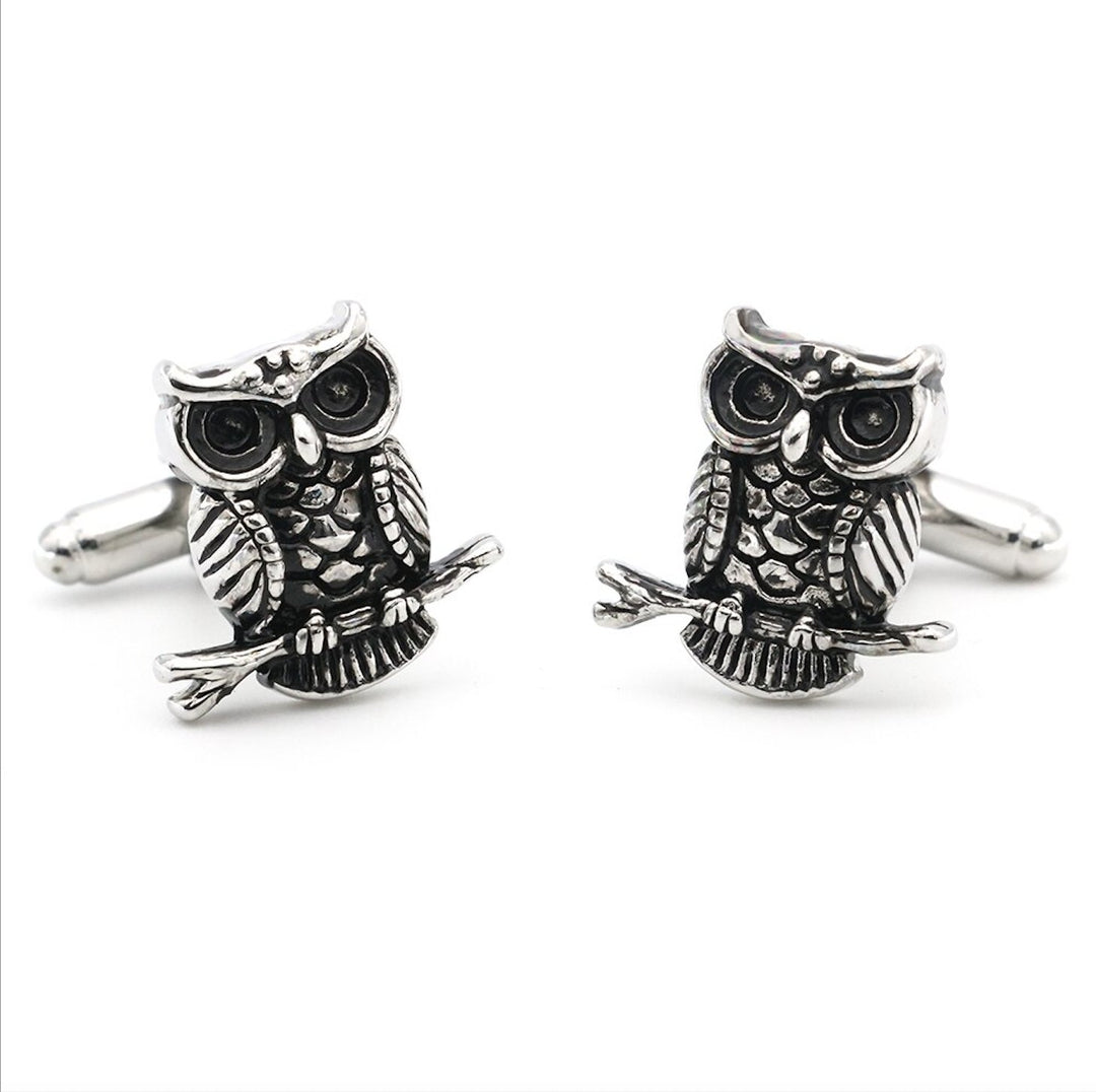 Charming wise owl cufflinks featuring intricate detailing, perfect for adding a touch of whimsy and sophistication to formal attire.