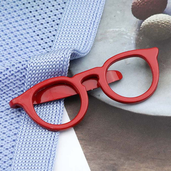 Red optometrist spectacles tie clips featuring a stylish and playful design, perfect for professionals in the eye care industry.