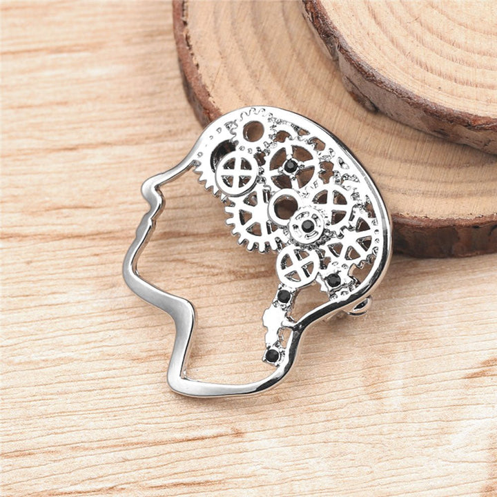 Brain Cog Wheel Pin in Silver - An elegant accessory suitable for healthcare professionals, educators, and social care workers, representing knowledge and innovation