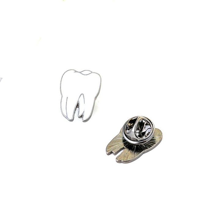 White Enamel Tooth Lapel Pin with a sleek design, perfect for dental professionals and enthusiasts.