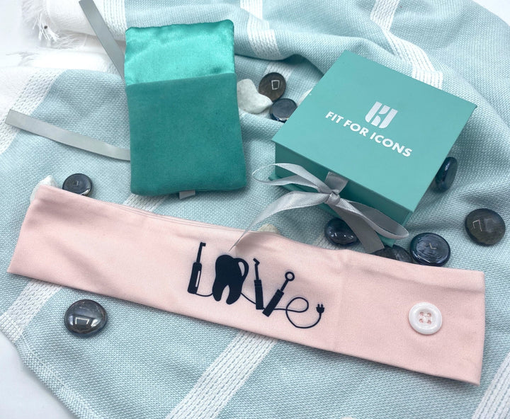 Dentistry LOVE Headband in Pink - A stylish and vibrant headband featuring the word 'LOVE' and dental motifs, perfect for dental professionals to wear at work or during events to express their passion for dentistry.