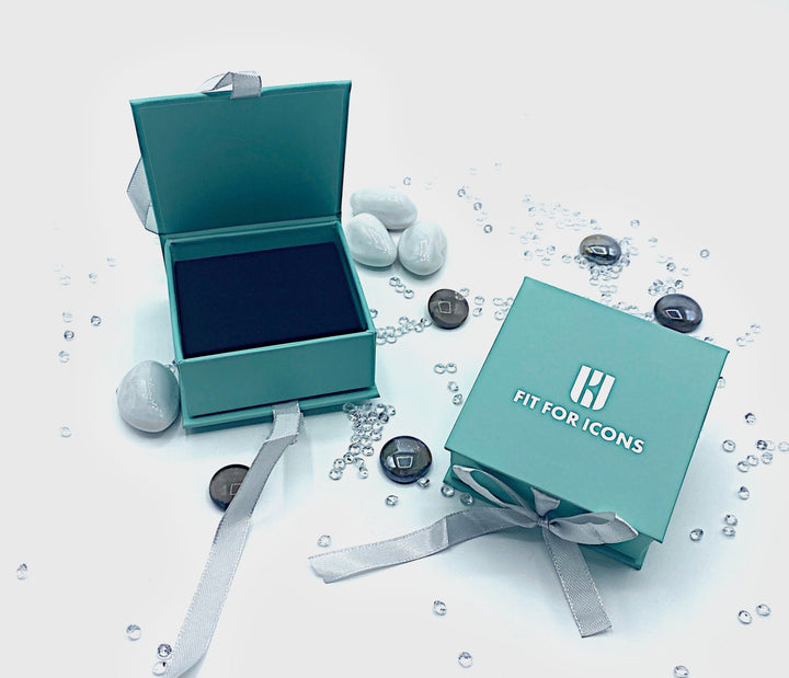 Gifts For Icons small teal coloured  jewellery box with black velvet inlay and silver satin ribbon tied