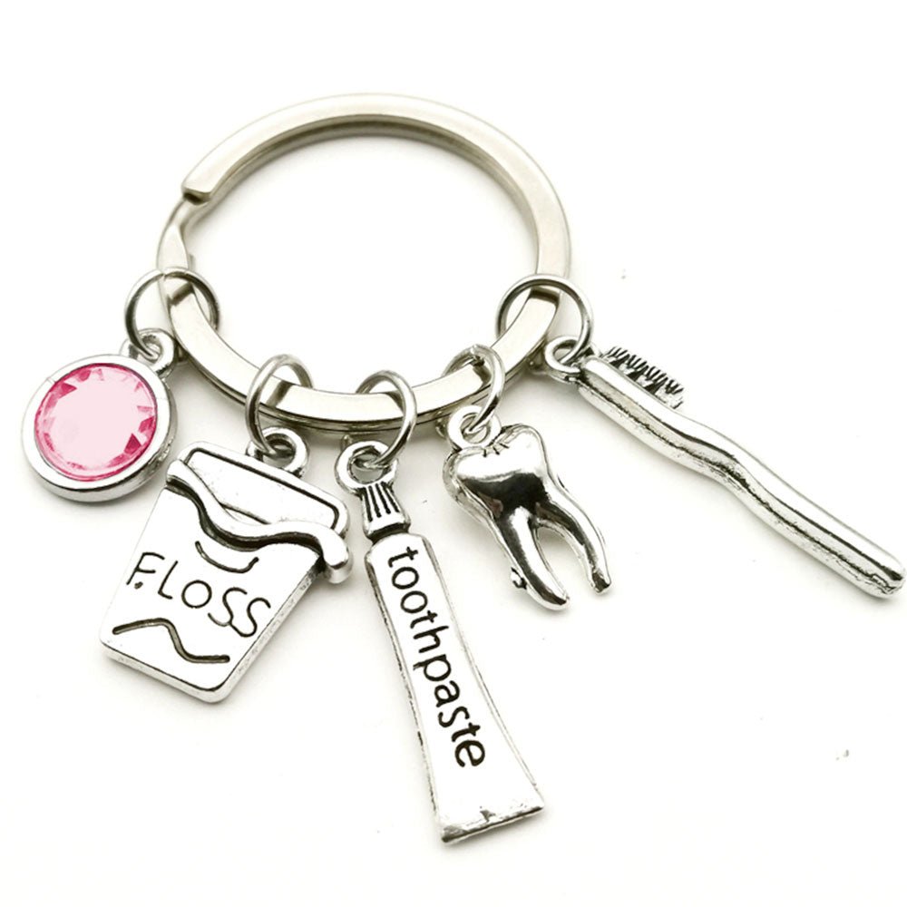 Dentistry Tooth and Equipment 5 Charm Keyring - A stylish keyring featuring five sparkling diamante dental-themed charms, including a tooth and dental tools, perfect for showcasing your passion for dentistry.