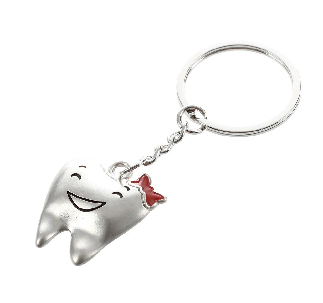 Smiley Tooth Red Bow Keyring - Charming accessory for dental professionals, ideal for adding a touch of fun to keys and bags.