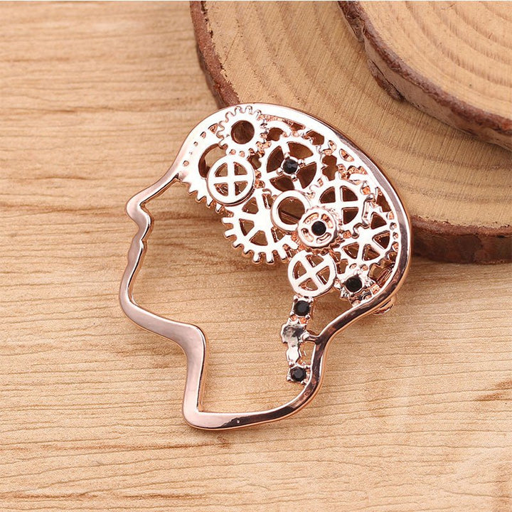 Brain Cog Wheel Lapel Pin Brooch in Rose Gold - A stylish accessory for healthcare professionals, educators, and social care workers, symbolizing creativity and intelligence.