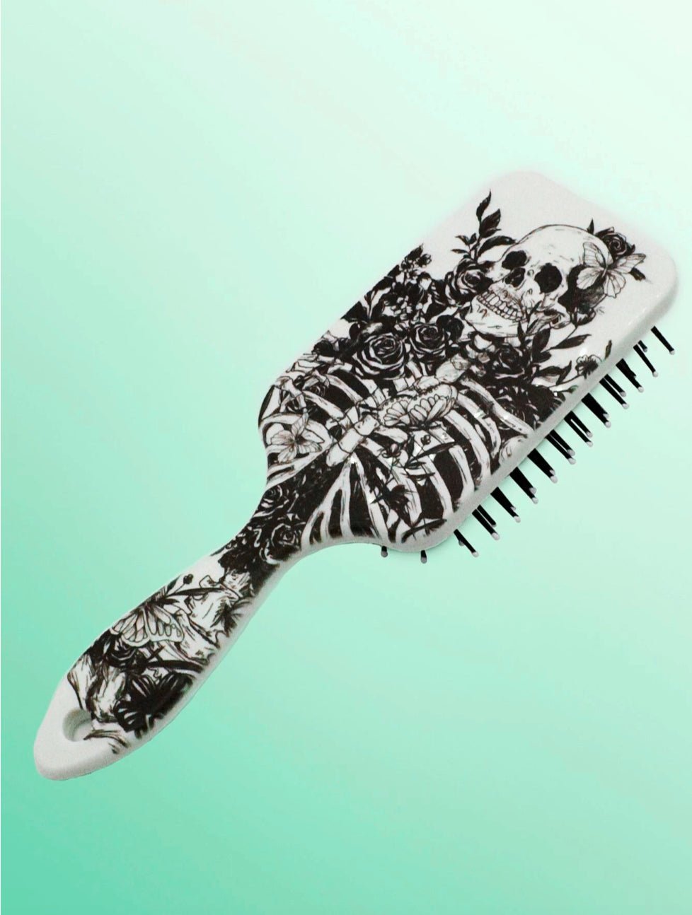 Skeleton Design Hairbrush - A unique hairbrush featuring a playful skeleton design, combining functionality with a fun aesthetic, perfect for adding a touch of whimsy to your hair care routine.