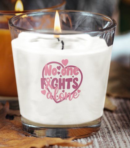 No-one Fights Breast Cancer Alone scented candle, featuring a heartfelt message of support, perfect for health professionals, social care workers, and individuals looking to provide encouragement in the fight against breast cancer.