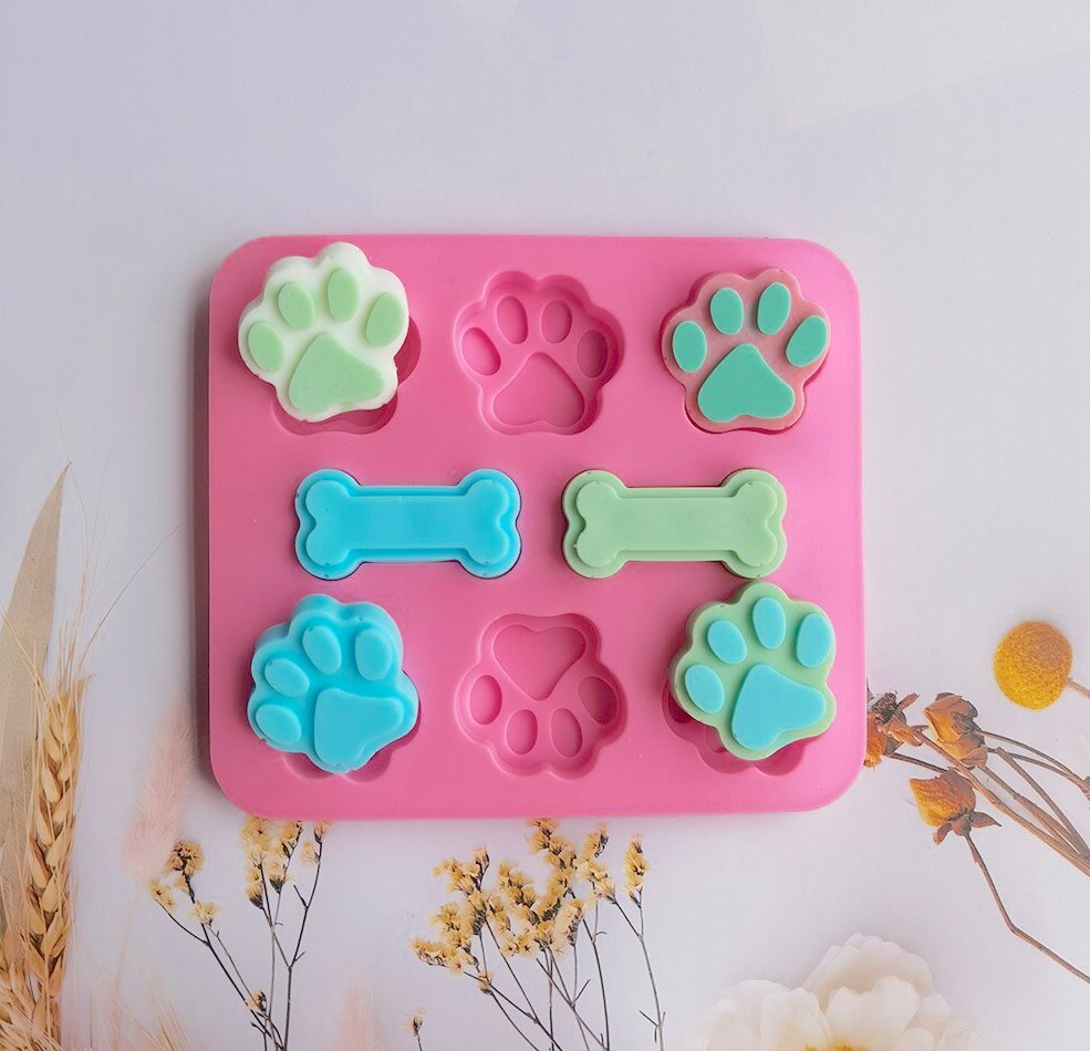 Fun paw and bone-shaped ice cube tray mold for pet lovers, perfect for creating themed ice cubes that celebrate your love for pets.