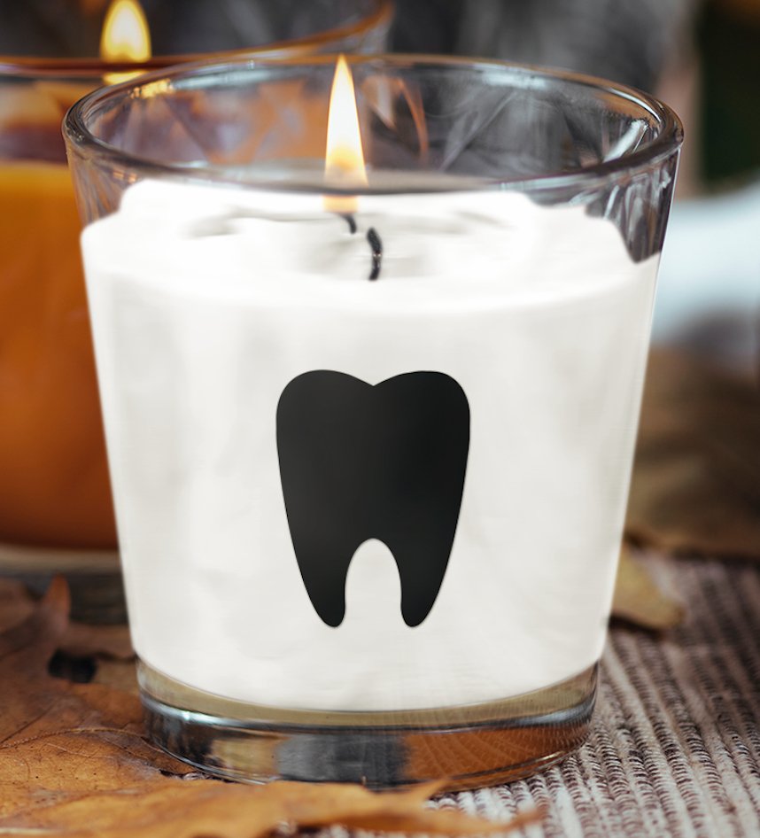 Black tooth design scented candle, elegantly styled and perfect for adding a unique touch to home decor while providing a soothing aroma.