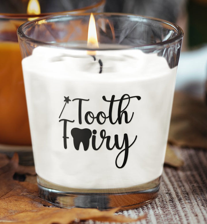 Delicate Tooth Fairy scented candle in a whimsical container, designed to evoke a sense of magic and tranquility.