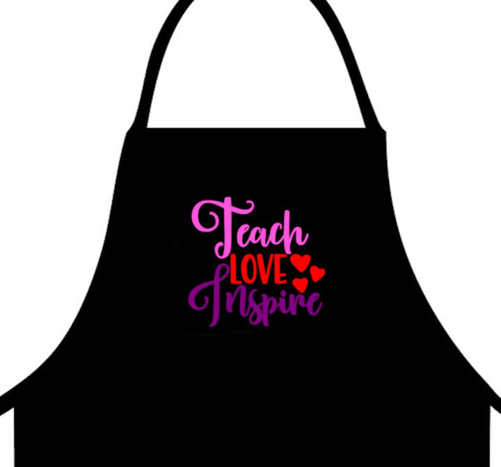 Teach Love Inspire Apron - A durable and stylish apron perfect for educators, providing a functional and inspiring look for teachers in classrooms or workshops.