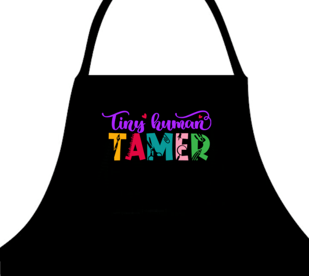 Tiny Human Tamer Apron - a playful apron designed for parents or caregivers, featuring a fun 'Tiny Human Tamer' graphic, perfect for cooking, crafting, or messy play.