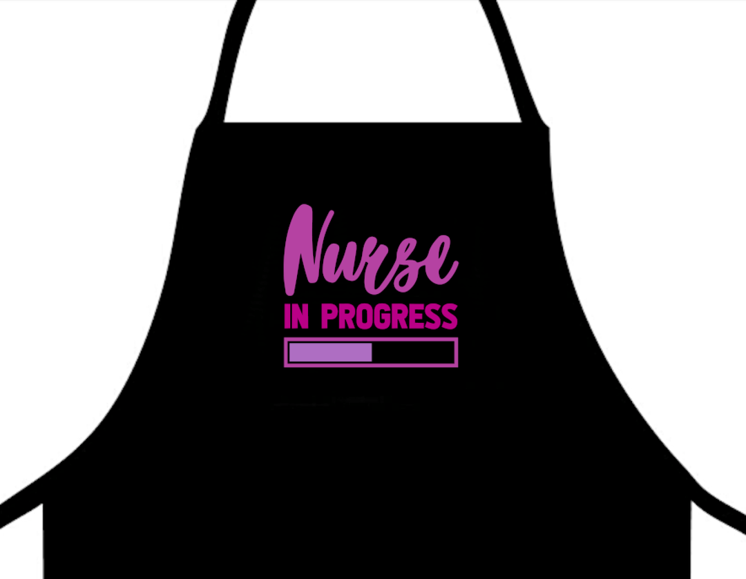 Nurse In Progress Apron featuring a playful design that showcases the phrase 'Nurse In Progress,' ideal for nurses and healthcare professionals, combining functionality with a lighthearted touch