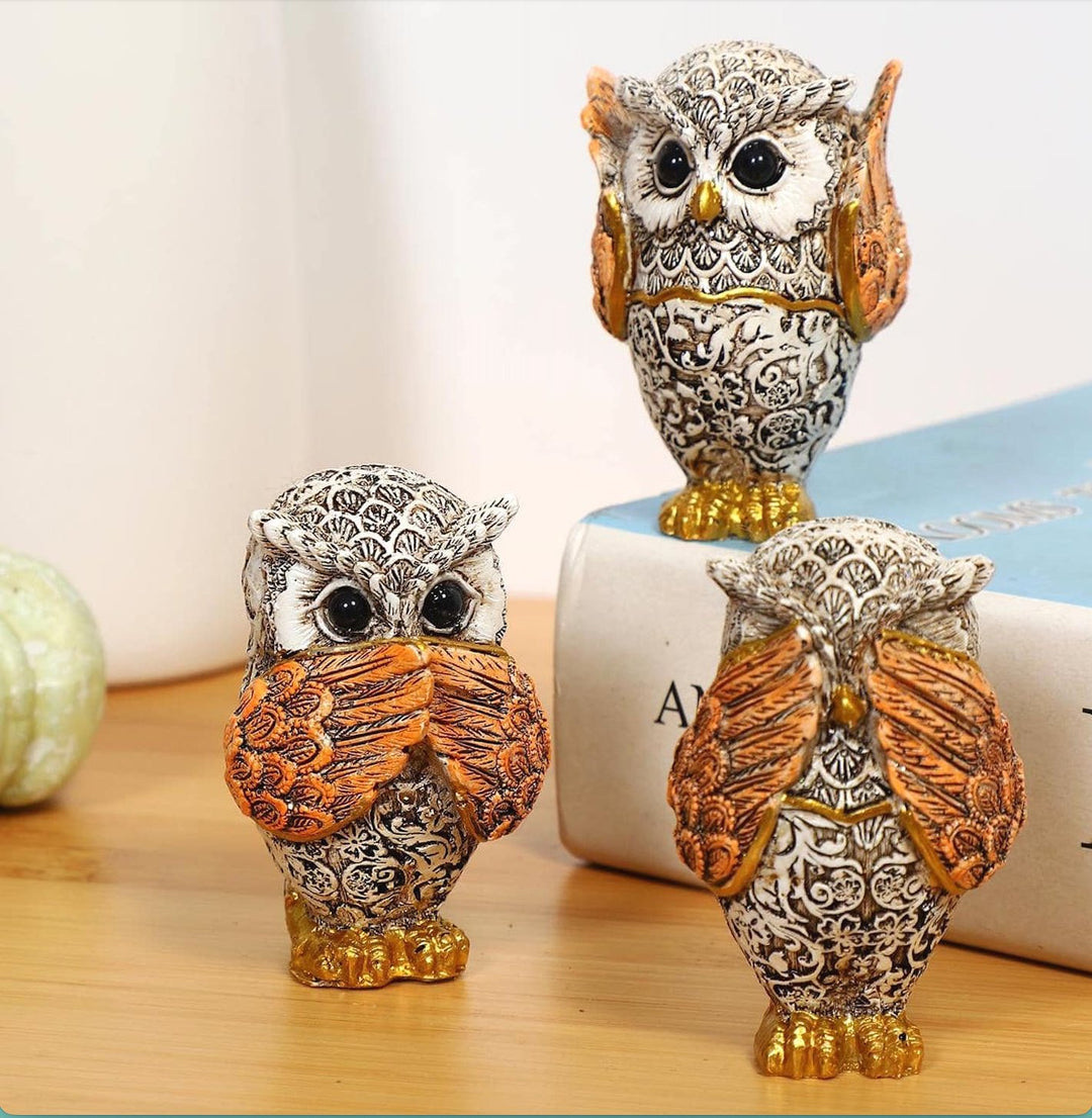 Set of three wise owl ornaments representing 'See No Evil, Speak No Evil, Hear No Evil,' crafted with intricate details and vibrant colors.