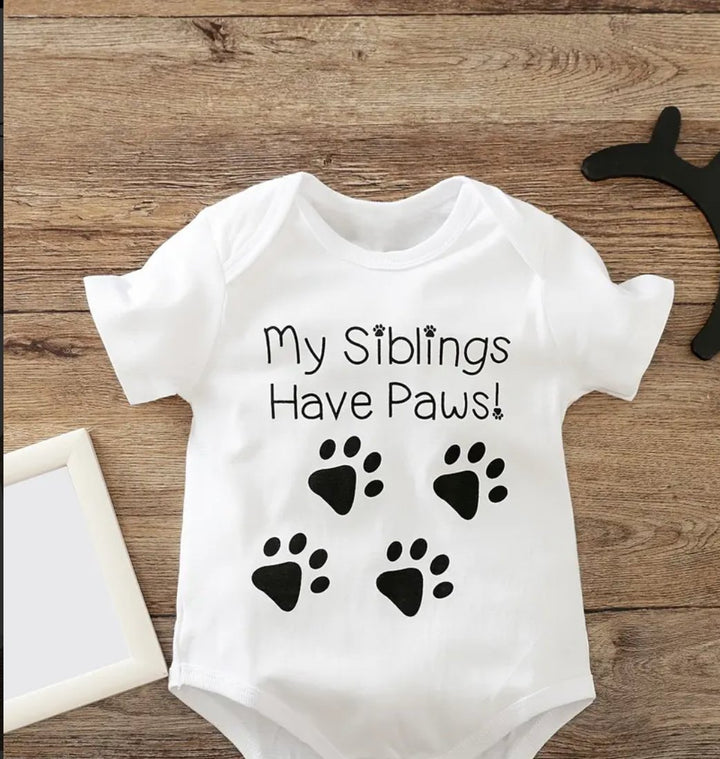 Siblings Have Paws Baby Vests - Adorable baby clothing featuring a playful design for families with pets, perfect for celebrating the bond between siblings and furry friends.