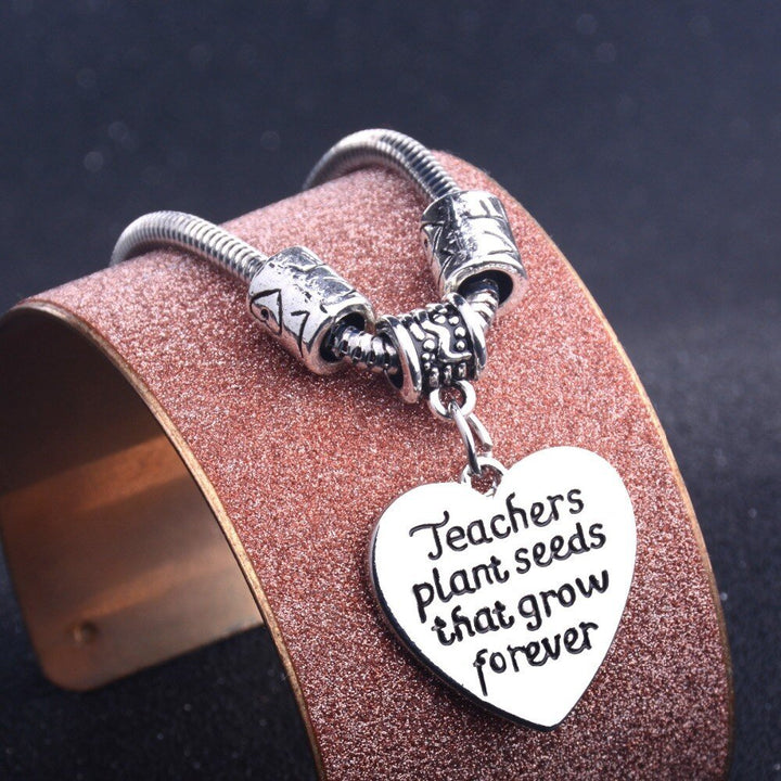 Teachers Plant Seeds Bracelet - A beautifully crafted bracelet adorned with charms representing growth and education, symbolizing how teachers plant seeds of knowledge. This meaningful piece is a perfect gift for educators, celebrating their impact in nurturing and shaping young minds.