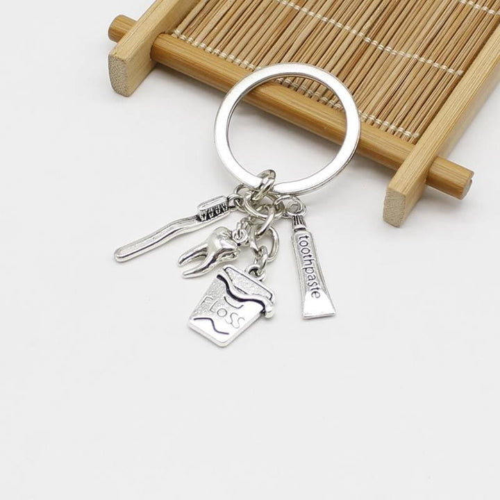 Dentistry Multi Equipment Four Charms Keyring - A delightful keyring featuring four dental-themed charms, perfect for dentists and dental professionals to keep their keys organized while showcasing their love for the dental field.