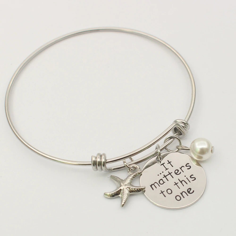 It Matters To This One Starfish Bracelet, a beautifully crafted piece featuring a charming starfish charm. This bracelet symbolizes individual impact and care for the environment, making it a meaningful accessory or gift for ocean lovers and advocates. Perfect for everyday wear or as a reminder of the importance of making a difference, one small step at a time