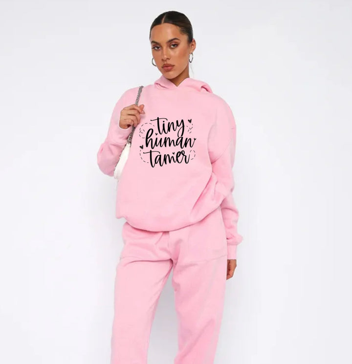 Tiny Human Tamer Teacher Pink Hoodie - a cozy and stylish hoodie featuring the playful 'Tiny Human Tamer' design, perfect for teachers who appreciate comfort and fun.