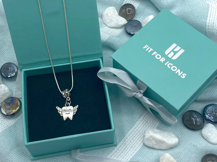 Charming winged tooth fairy necklace designed to inspire children in dental health education and a perfect gift for parents promoting positive dental habits.