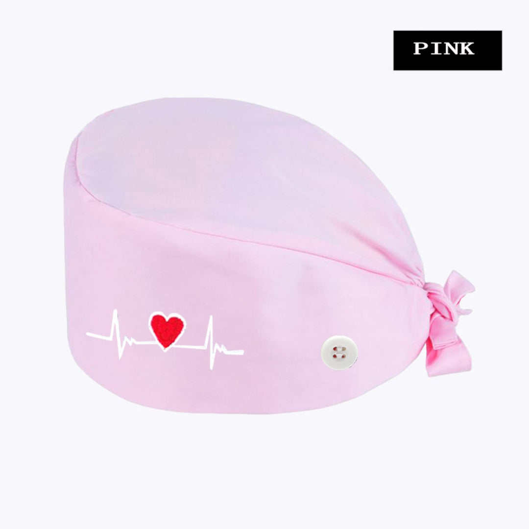 Whisper Pink scrub hat featuring an embroidered ECG heartbeat design, perfect for healthcare professionals who want to add a touch of style to their workwear.