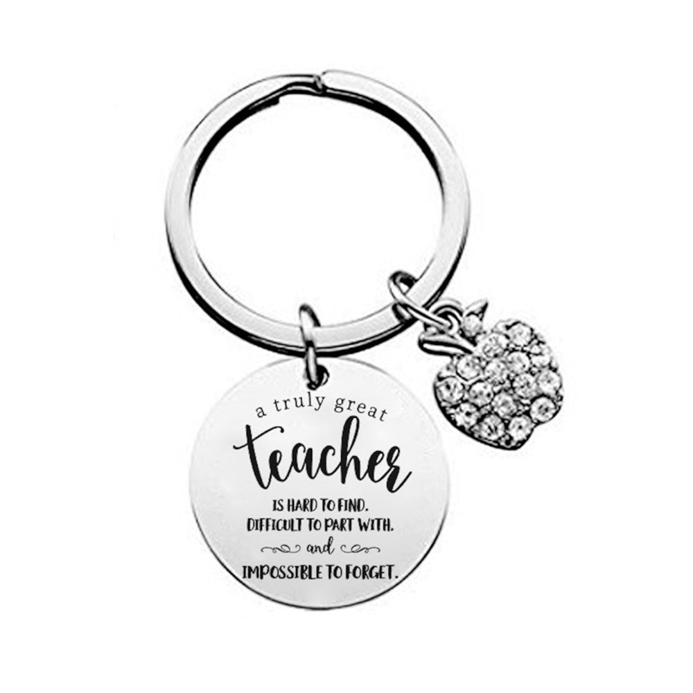 "Truly Great Teacher" silver keyring designed to honor the dedication and impact of teachers, combining elegance and sentiment in a practical accessory that reflects appreciation for their vital role in education.