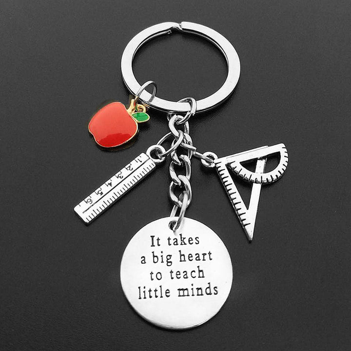 Teachers Big Heart Apple Keyring - A charming keyring featuring a heart-shaped apple design, symbolizing love for teaching. Perfect as a thoughtful gift for teachers and educators, this keyring adds a personal touch to keys or bags, celebrating the spirit of education.