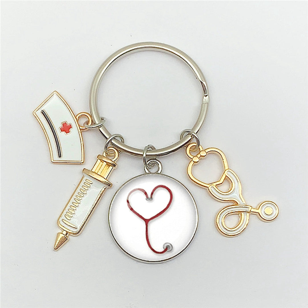 Gold and silver stethoscope heart cabochon nurse keyring, a charming accessory for healthcare professionals.