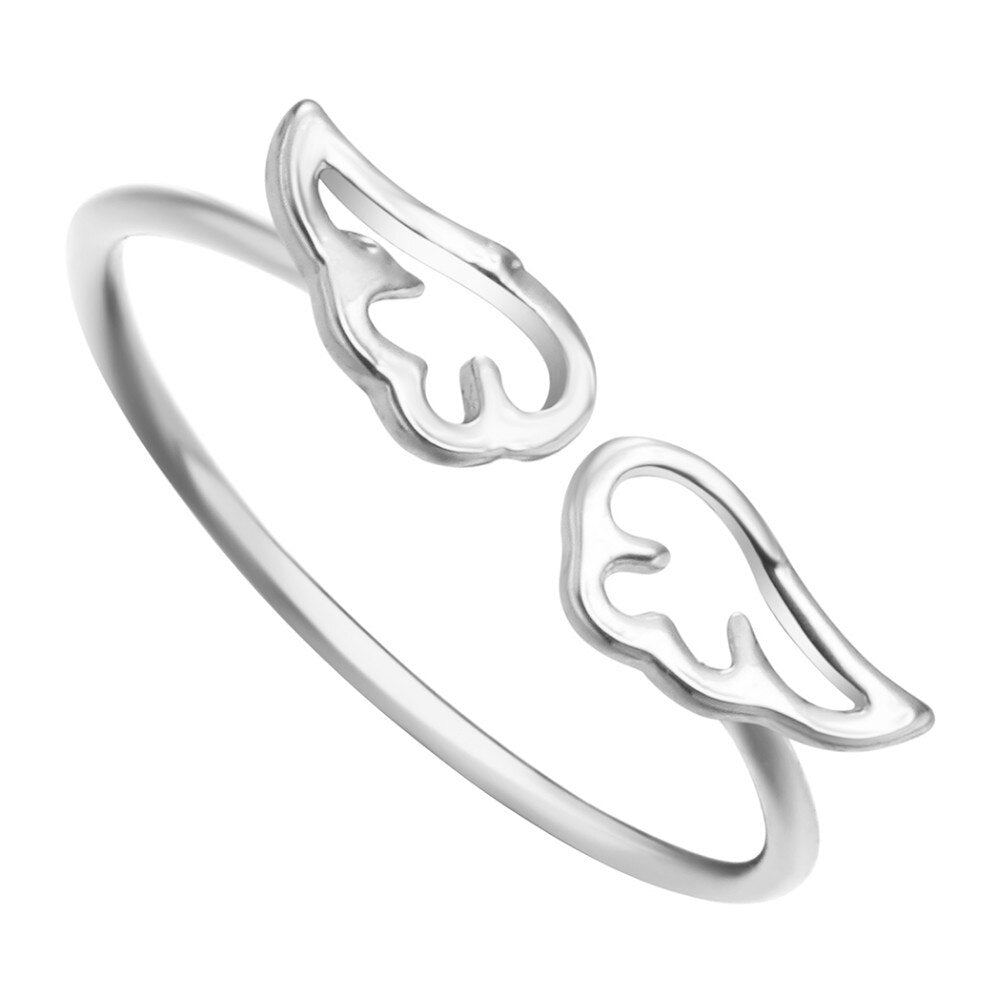 Elegant silver ring featuring a minimalist design with two angel wings at each end, symbolizing protection and inspiration, perfect for everyday wear.