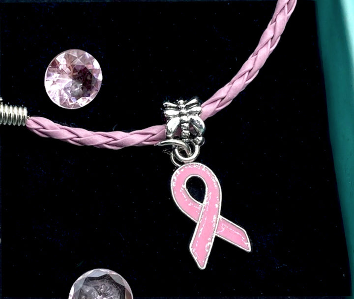 Pink Ribbon Breast Cancer Bracelet - Pink Silver – A beautifully crafted bracelet featuring a pink ribbon charm, ideal for healthcare professionals, social care workers, and advocates supporting breast cancer awareness and fundraising efforts.